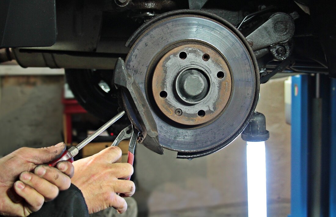 mechanic fixing brakes Picture