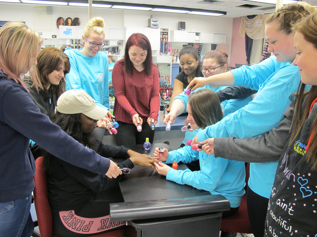 cosmetology students doing nails Picture